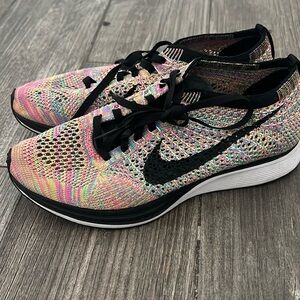 Nike flyknit racer sneakers multi color. Size men 6/ womens 7.5